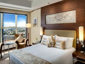 迪拜千禧国际酒店客房内的一张或多张床位