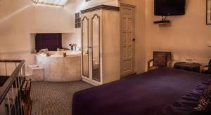 安第斯翼精品酒店客房内的一张或多张床位