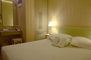 菲迪亚斯酒店客房内的一张或多张床位
