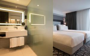 悉尼悉尼机场铂尔曼酒店的酒店客房设有床和水槽