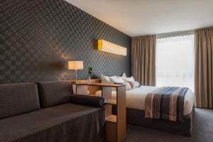 Best Western Plus Paris Saclay (ex: Val de Bièvre)客房内的一张或多张床位