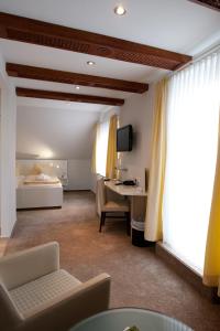 Frühstückshotel Seemannsbraut Amrum-adults only ab 18 Jahre-keine Haustiere-的电视和/或娱乐中心