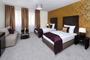 阿普兰德佩鲁贾城市酒店客房内的一张或多张床位