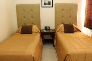 卡萨丽塔公寓式酒店客房内的一张或多张床位