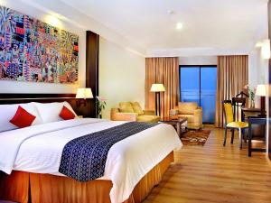 Aston Pontianak Hotel and Convention Center客房内的一张或多张床位