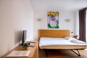 禅尼图德波特斯阿尔萨斯公寓式酒店 客房内的一张或多张床位