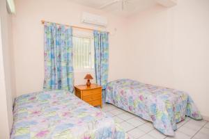 Bougainvillea Apartments客房内的一张或多张床位