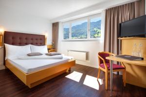 泽拉什瑞士优质酒店客房内的一张或多张床位