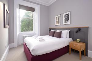 苏格兰迪斯提尼公寓 - 酿酒屋客房内的一张或多张床位