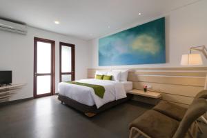 沙努尔艺术别墅客房内的一张或多张床位
