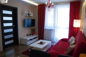 Apartament Szmaragdowy的休息区