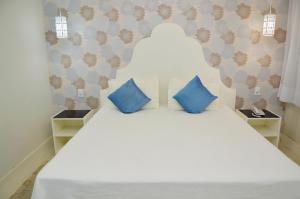 Hotel Girassol客房内的一张或多张床位