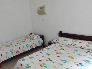 Apartamento 1 Dormitório Astúrias客房内的一张或多张床位
