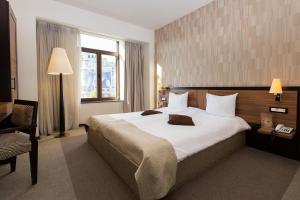欧洲酒店皇家布加勒斯特客房内的一张或多张床位