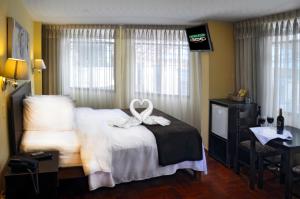 Casona Plaza Hotel Centro客房内的一张或多张床位