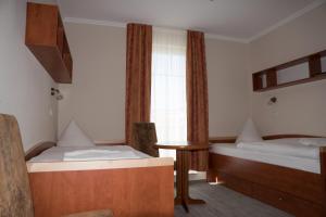 吕根岛别墅酒店客房内的一张或多张床位