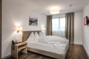 AlpenParks Hotel & Apartment Orgler Kaprun客房内的一张或多张床位