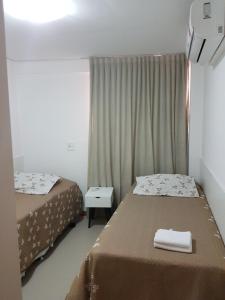 Rosa Branca Facilities Apartamentos客房内的一张或多张床位