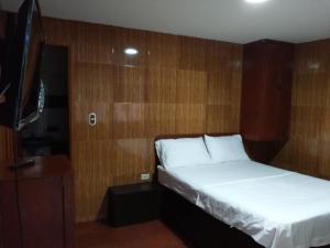 Hotel Campestre Kosta Azul客房内的一张或多张床位