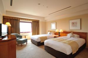广岛机场酒店 客房内的一张或多张床位