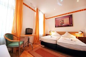 斯托赫城市酒店客房内的一张或多张床位