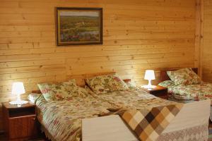 Guesthouse Puzhalova Izba客房内的一张或多张床位