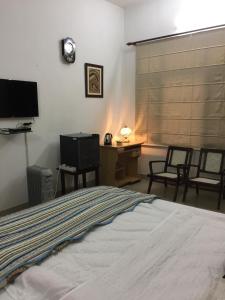 Luxurious Homestay- Chandīgarh客房内的一张或多张床位