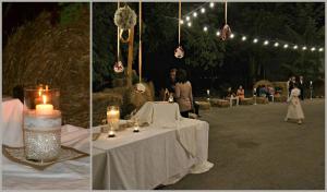 廖内罗因武尔图雷Country House Villa delle Rose Agriturismo的两张桌子的照片,上面有蜡烛和灯光