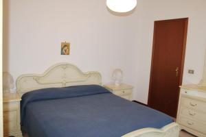 Appartamento Grado 5客房内的一张或多张床位