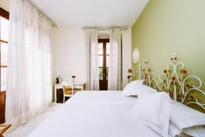 Basic Hotel Doña Manuela客房内的一张或多张床位