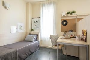 希内尔德洛斯里奥斯大学公寓旅舍客房内的一张或多张床位