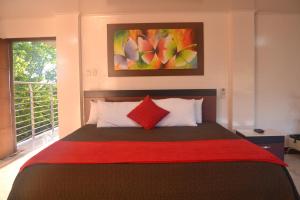 Eco Hotel El Bosque Campestre de Valledupar客房内的一张或多张床位
