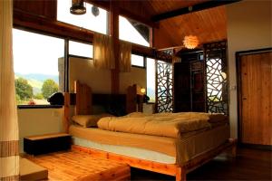 丽江白沙自由岁月设计旅店客房内的一张或多张床位