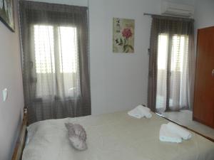 Apalos Apartments客房内的一张或多张床位