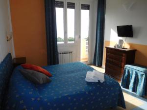 Baia delle Favole Affittacamere客房内的一张或多张床位