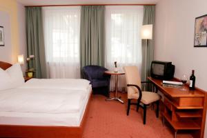 弗洛瑞安尔霍夫酒店客房内的一张或多张床位