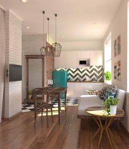 塔什干艺术一室公寓的厨房以及带桌椅的起居室。