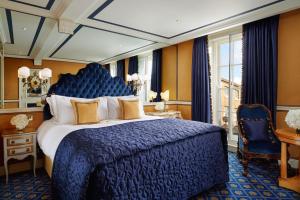 红色康乃馨皇宫中的鲁本斯酒店客房内的一张或多张床位