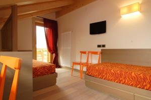 Dolomiti Lodge Villa Gaia客房内的一张或多张床位