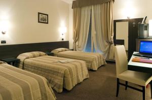 菲尔拉康体Spa酒店客房内的一张或多张床位