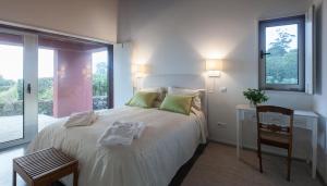 Quinta da Tilia Boutique Retreat客房内的一张或多张床位