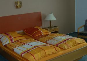 Hotel Bürgerstube客房内的一张或多张床位