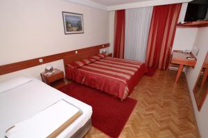 Hotel Narona客房内的一张或多张床位