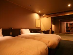 新淡路酒店客房内的一张或多张床位