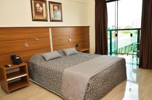 Tamareiras Prime Hotel客房内的一张或多张床位