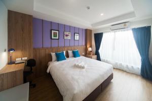 Anchan Laguna Hotel โรงแรมอัญชันลากูน่า客房内的一张或多张床位