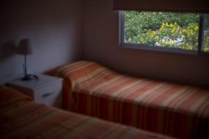 El Faro Apart客房内的一张或多张床位