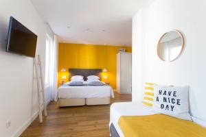 Aveiro Rossio Bed & Breakfast客房内的一张或多张床位