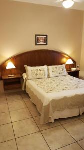 Hotel Suma Huasi客房内的一张或多张床位
