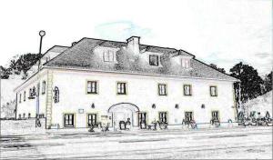 克拉根福Gasthof Schlosswirt的白色大建筑的图画